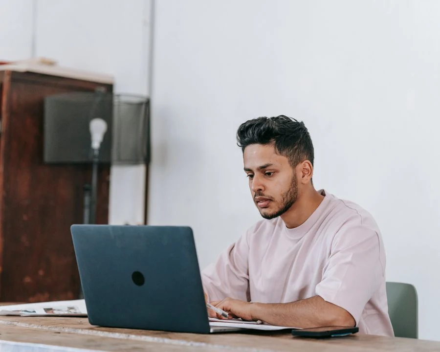 A WordPress site owner working at a laptop